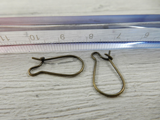 Korvakorukoukku, 18x9mm, pronssi, 10paria