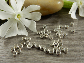 Puristushelmi 2.5mm, kirkashopea, 50kpl