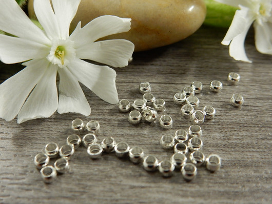 Puristushelmi 2.5mm, kirkashopea, 50kpl