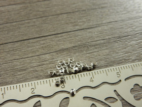 Puristushelmi, 2mm, kirkashopea, 50kpl