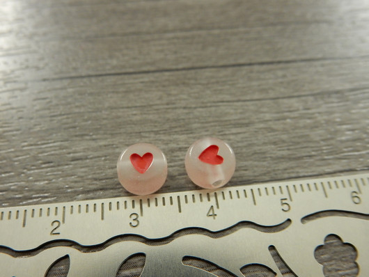 Akryylihelmi pimeässä hohtava sydän, 7mm, kirkas/punainen, 20kpl
