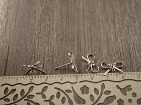 Korvakorutappi lenkillä rusetti, 10x15mm, kirkashopea, 1pari