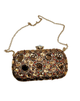 Minaudière, pieni, korumainen naisten juhla-iltalaukku. Eri värejä