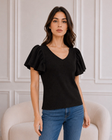 Kimaltelevan musta ja fuksia Lurex-neulepaita