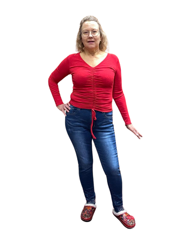 Pitkähihainen pusero, jossa on V-pääntie ja edessä säädettävät nyörit.