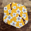 Keltainen luomupuuvilla kestopikkuhousunsuoja