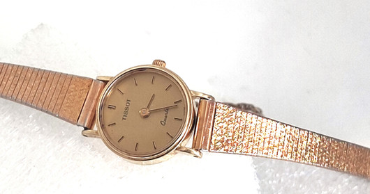 14ct golden Tissot 