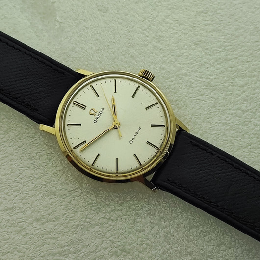 vintage solid  golden Omega Geneve . rare cal 131.050