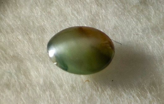Alexandrite 4,8 x 3,8 mm / 0,3 ct oval, cat eye effect with certificate