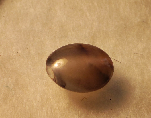 Alexandrite 4,8 x 3,8 mm / 0,3 ct oval, cat eye effect with certificate