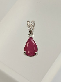 individual silver pendant with real Ruby and decorative stones