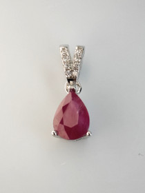 individual silver pendant with real Ruby and decorative stones