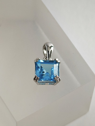 individual silver pendant with real Topaz