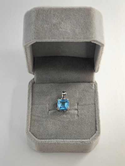 individual silver pendant with real Topaz