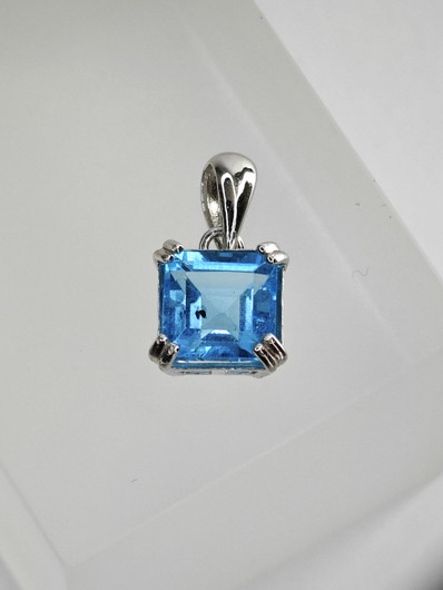 individual silver pendant with real Topaz
