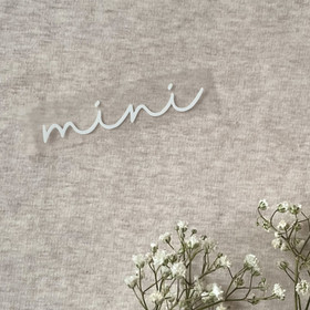 Silityskuva teksti: Mini, sirompi valkoinen