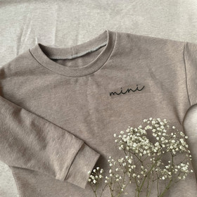 Silityskuva teksti: Mini, sirompi musta