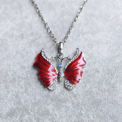Kaunis emaloitu kimalteleva punainen perhonen kaulakoru