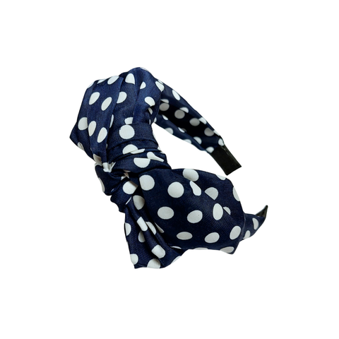 Leveä tummansininen polka dot rusettipanta valkoisilla pilkuilla