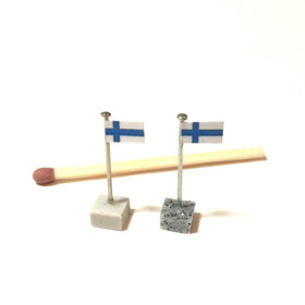 Nukkekodin Suomen lippu -pöytäkoriste