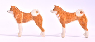 Akita rintaneula tai magneetti