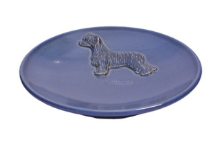 Kiinanharjakoira puuterihuisku teelautanen tai kauhanalunen