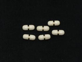 Puhvelinluunappi, pieni kapseli