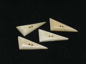 Puhvelinluunappi, terävä kolmio