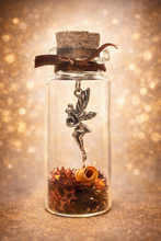 Luovuuden Keiju lasipullossa	