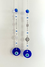 Pahansilmän sieppari,noidansolmu-amuletilla, lasinen suojelava silmä