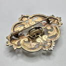 Rintakoru, design Toivo J. Suuronen, hopeaa