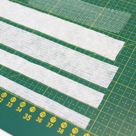 Joustamaton silitettävä tukinauha 10mm ja 25mm, 100m kiekko