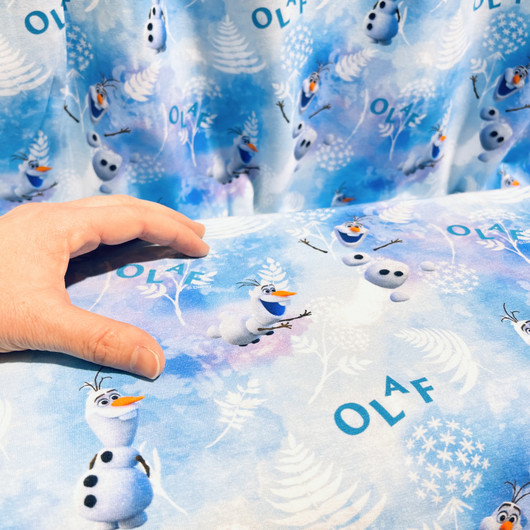 Frozen -trikookangas: Olaf, vaaleansininen - valkoinen 
