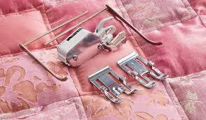 Yläsyöttäjä vaihdettavin paininjaloin