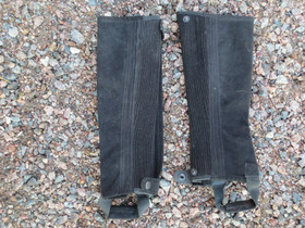 Lähes uudenveroiset mustat minichapsit aikuisten XS