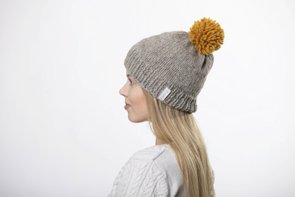Beanie with big yellow pom pom
