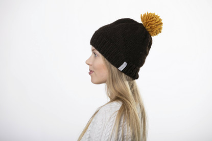 Beanie with big yellow pom pom