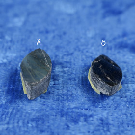 Spektroliitti kapussi hiomaton linssin muotoinen. Ylämaa Suomi A-Ä,Ö