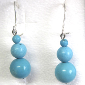 Korvakorut turkoosivärjätty magnesiitti lumiukko