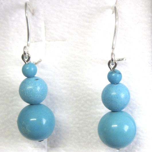 Korvakorut turkoosivärjätty magnesiitti lumiukko