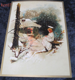 Joulukortti enkeli istuu mökin ikkunan takana. ken27