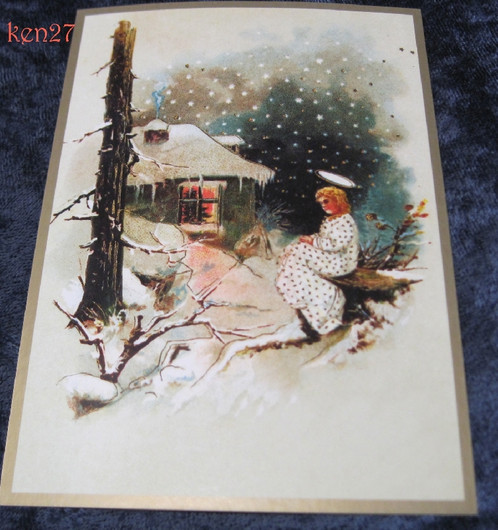 Joulukortti enkeli istuu mökin ikkunan takana. ken27
