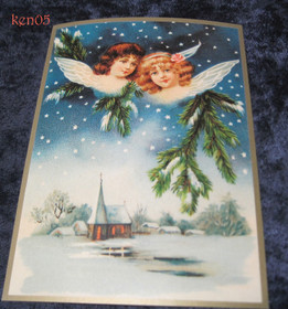 Joulukortti 2 enkeliä kirkon yllä. ken05