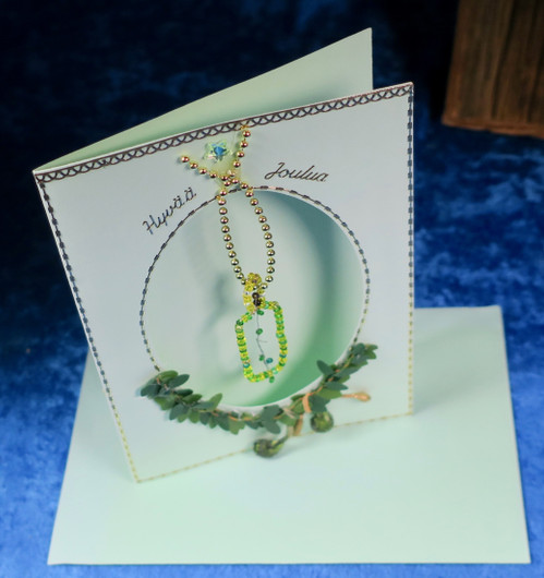 Postikortti Hyvää Joulua. Kynttilä helmistä punottu hopealankaan. jou3