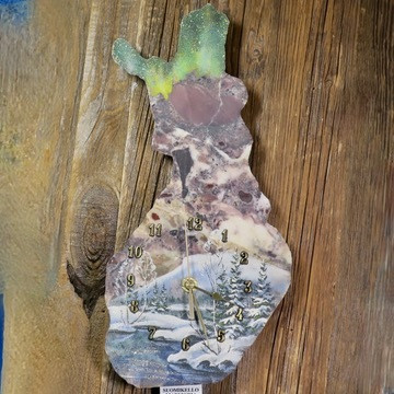 Seinäkello Suomi kivikello revontulet talvinen lapin maisema K