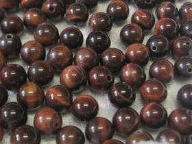 Häränsilmä 8mm punaruskea irtohelmi