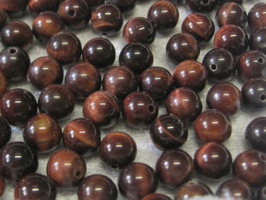 Häränsilmä 8mm punaruskea irtohelmi