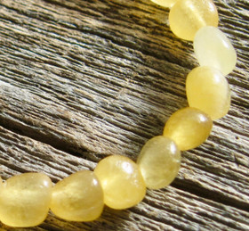 Kalsiitti keltainen rumpuhiottu 7x9 mm irtohelmi