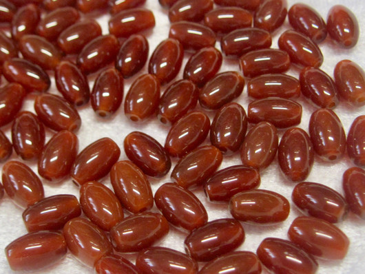 Karneoli 9x6mm riisin mallinen oranssi irtohelmi 