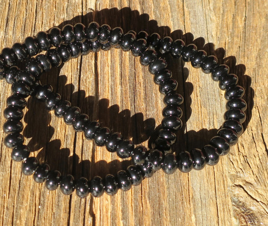 Onyksi litteä pallo 6x4mm musta irtohelmi